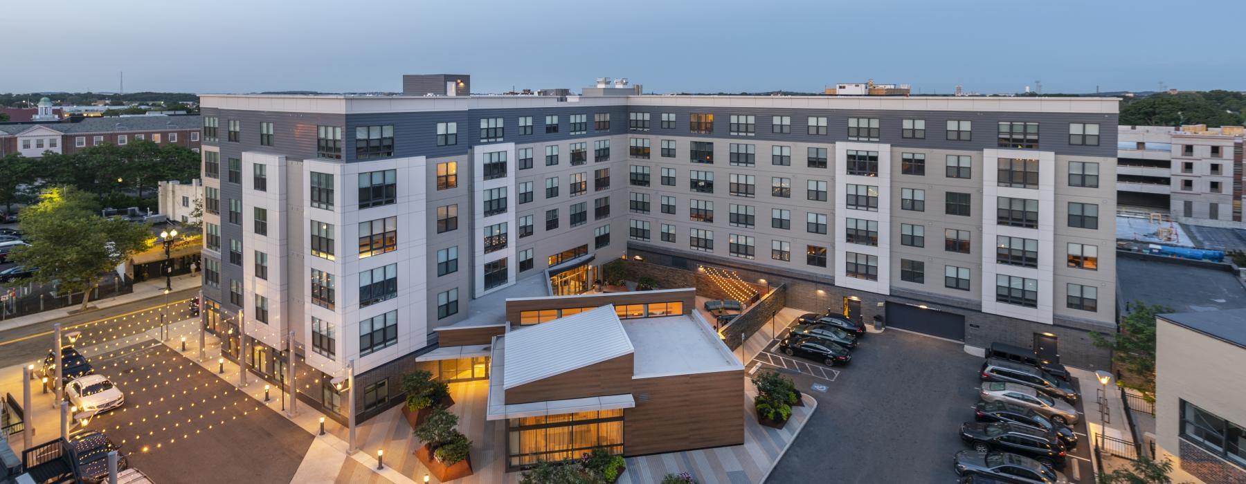 a large building with a parking lot