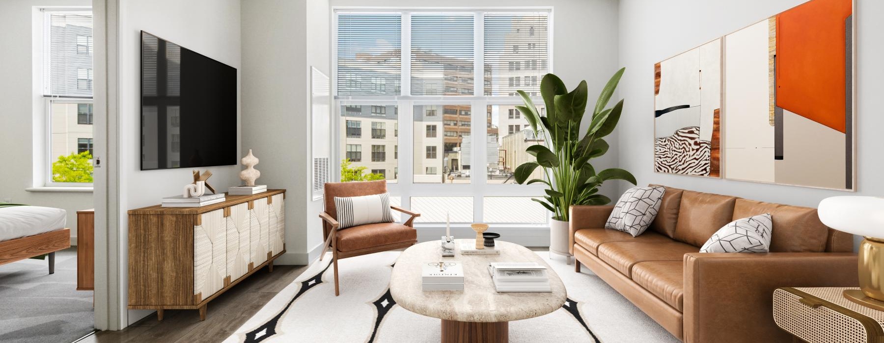 a living room with a tv and couches